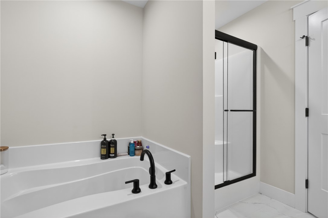 106 Bolt Road Townville, SC 29689 - Photo 16 of 33 Luxurious soaking tub and enclosed shower create a spa-like bathroom retreat.