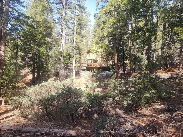 a roof deck with table and chairs