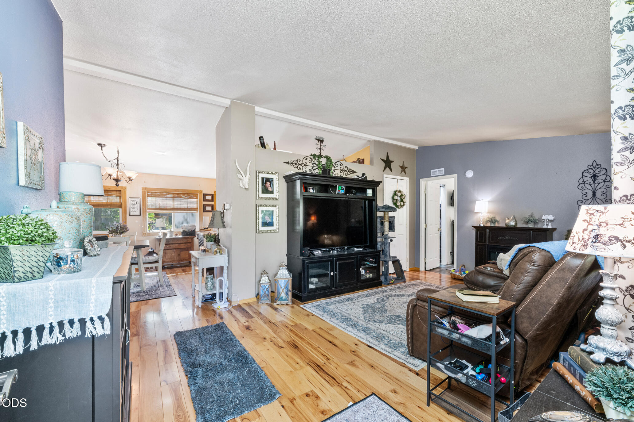 690 Foots Creek Road Gold Hill, OR 97525 - Photo 7 of 45 a living room with furniture and a flat screen tv