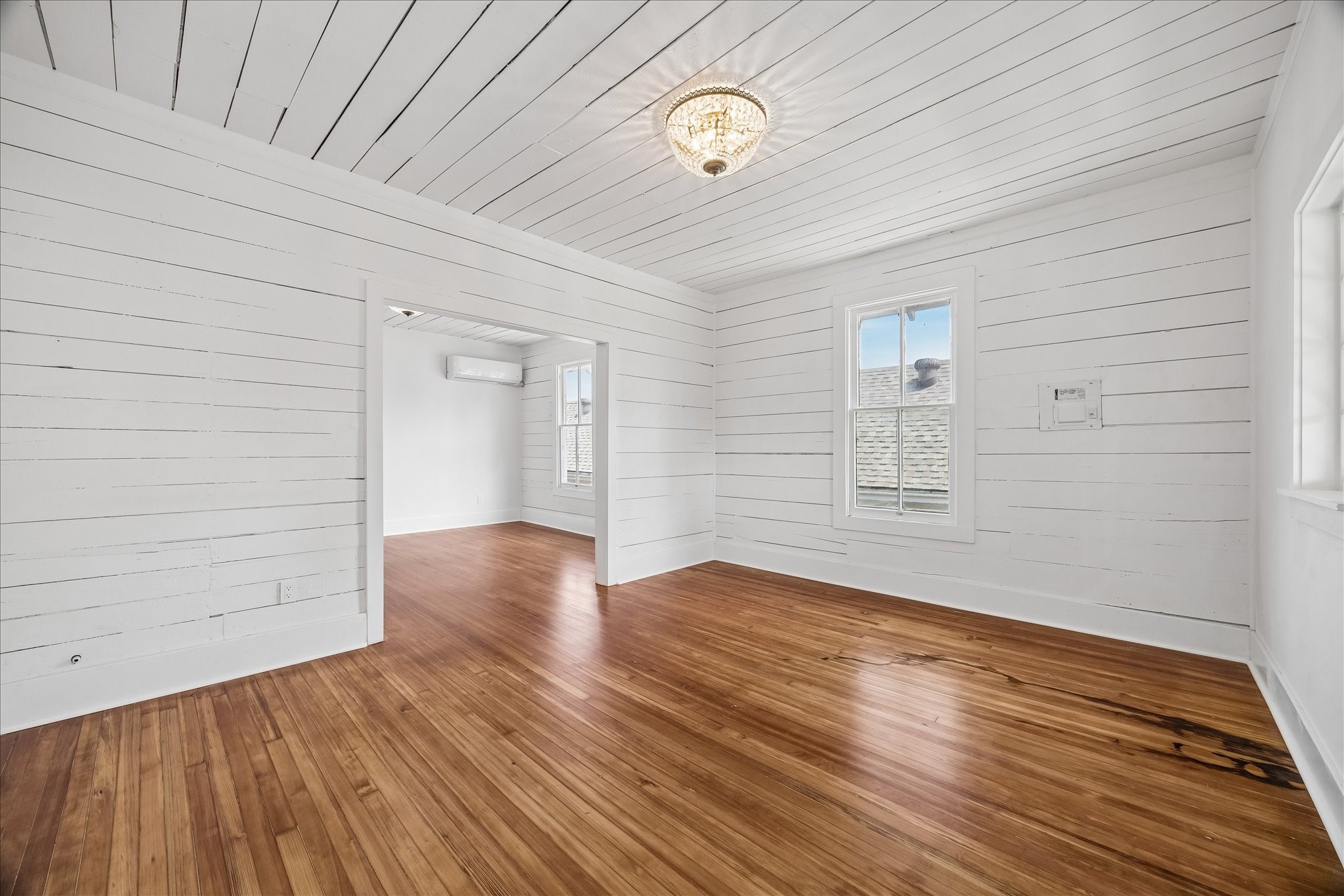 1812 Kane Street Houston, TX 77007 - Photo 28 of 41 Two large flex rooms feature shiplap walls and red oak floors all original to the house and refinished.