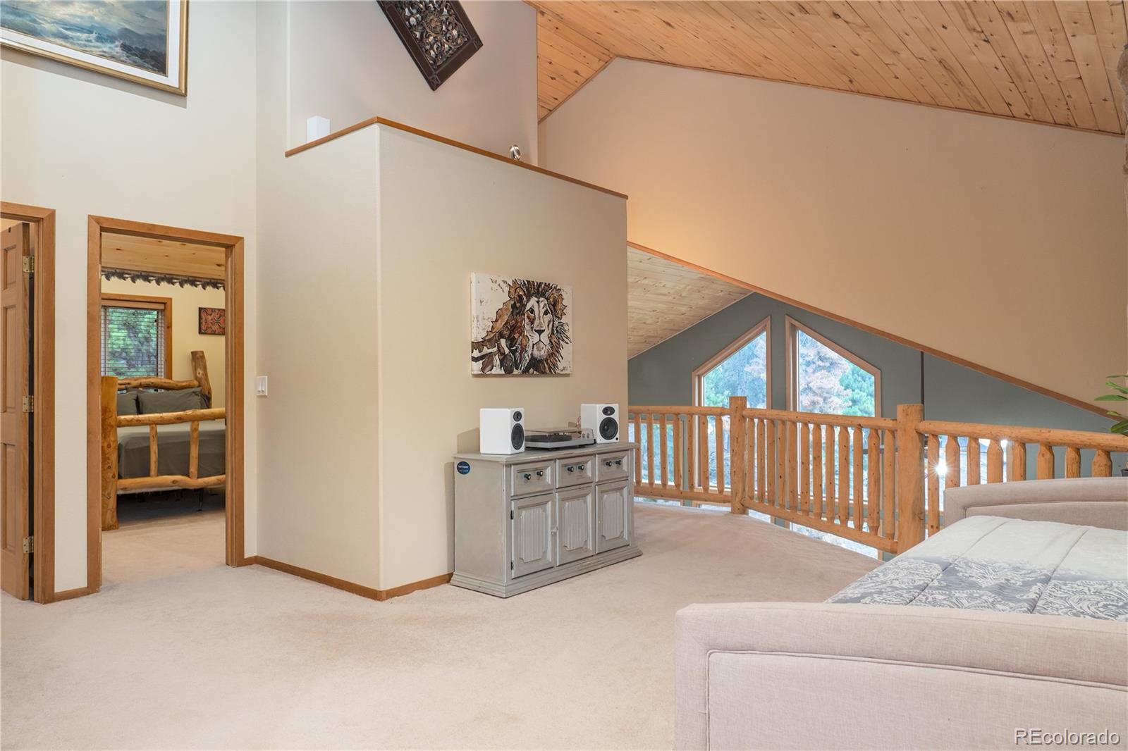 37 Juniper Court Evergreen, CO 80439 - Photo 22 of 44 a view of livingroom with furniture and windows