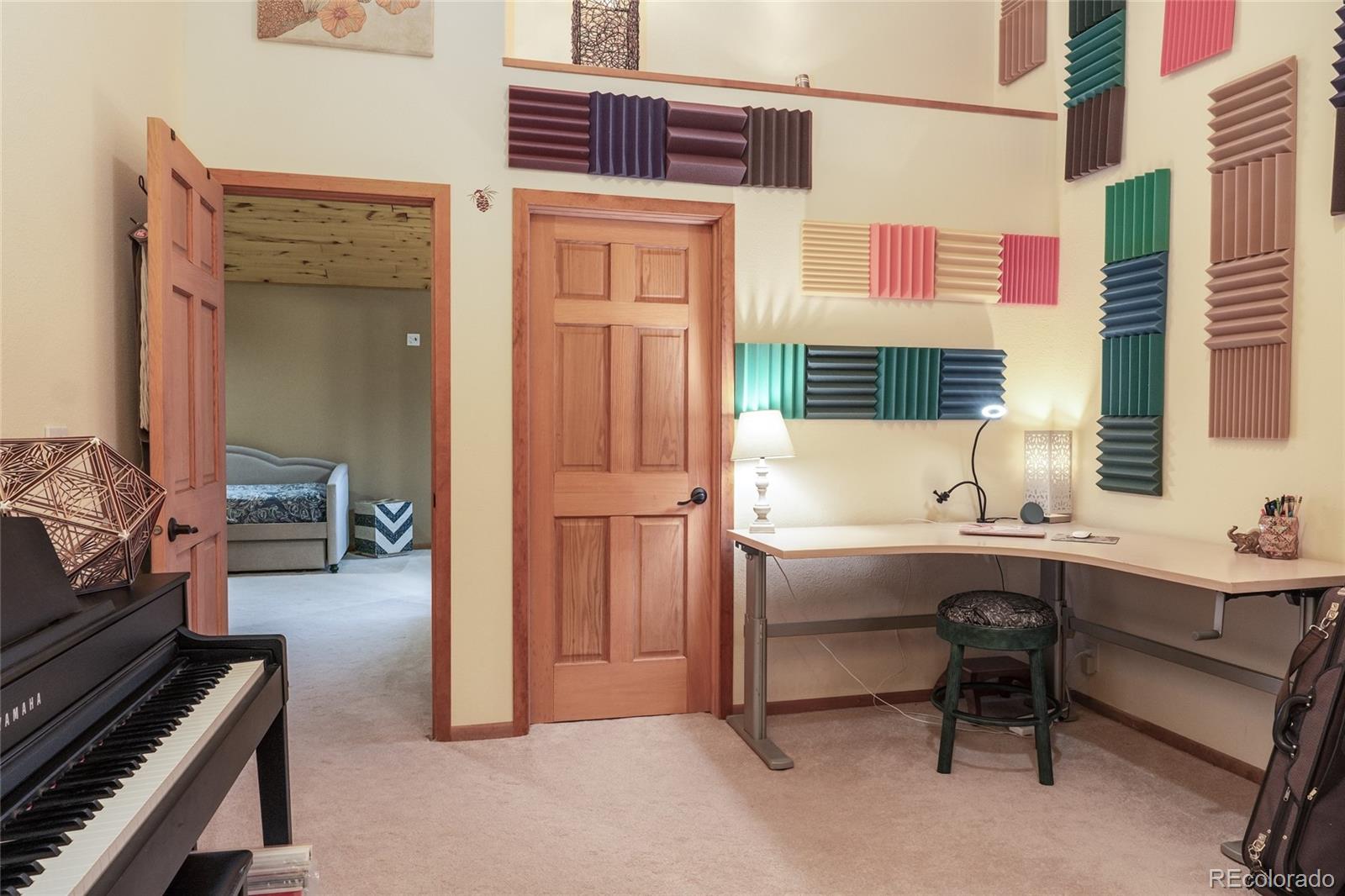 37 Juniper Court Evergreen, CO 80439 - Photo 26 of 44 a view of a workspace with furniture and a window