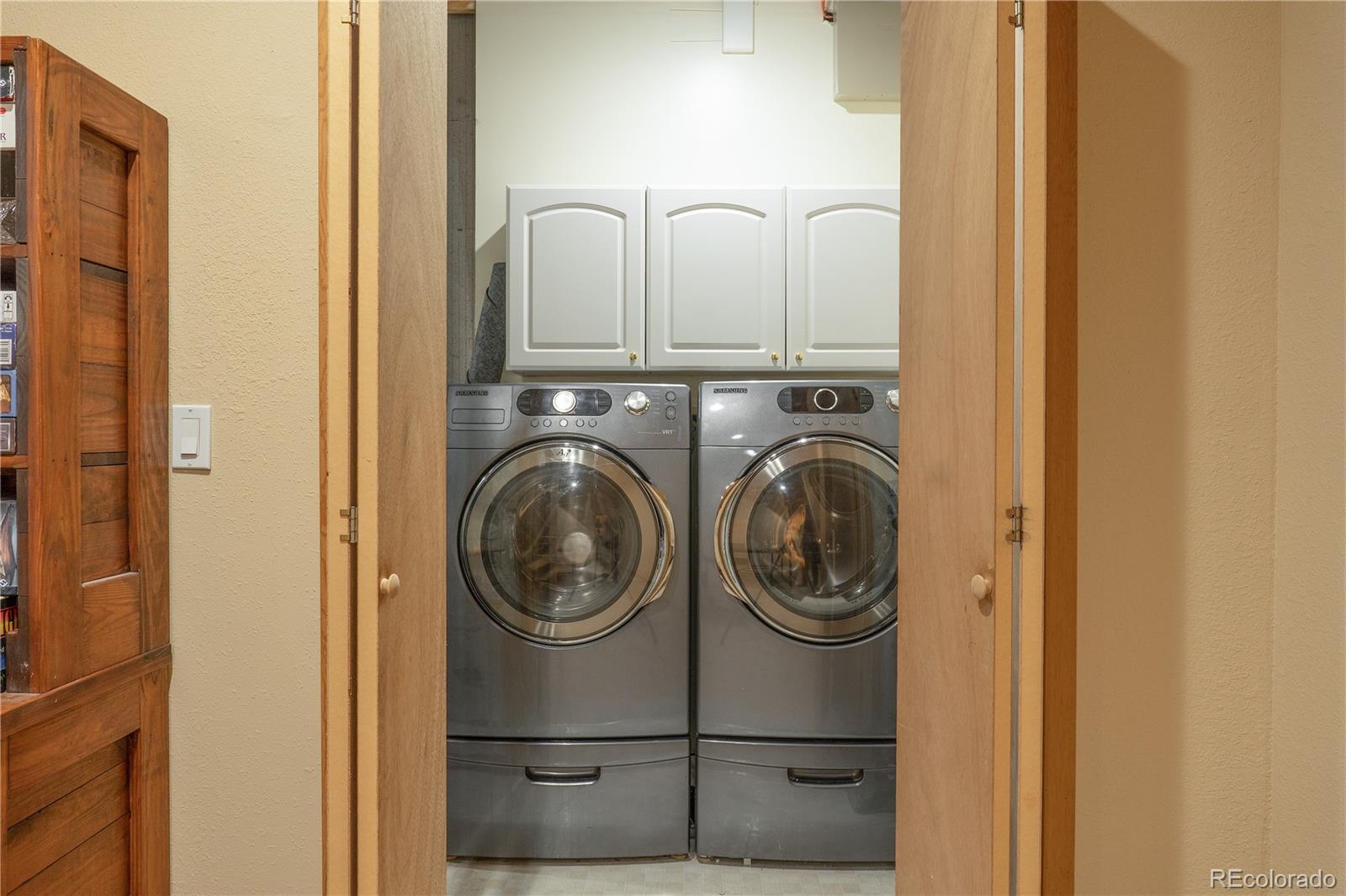 37 Juniper Court Evergreen, CO 80439 - Photo 33 of 44 a utility room with dryer and washer