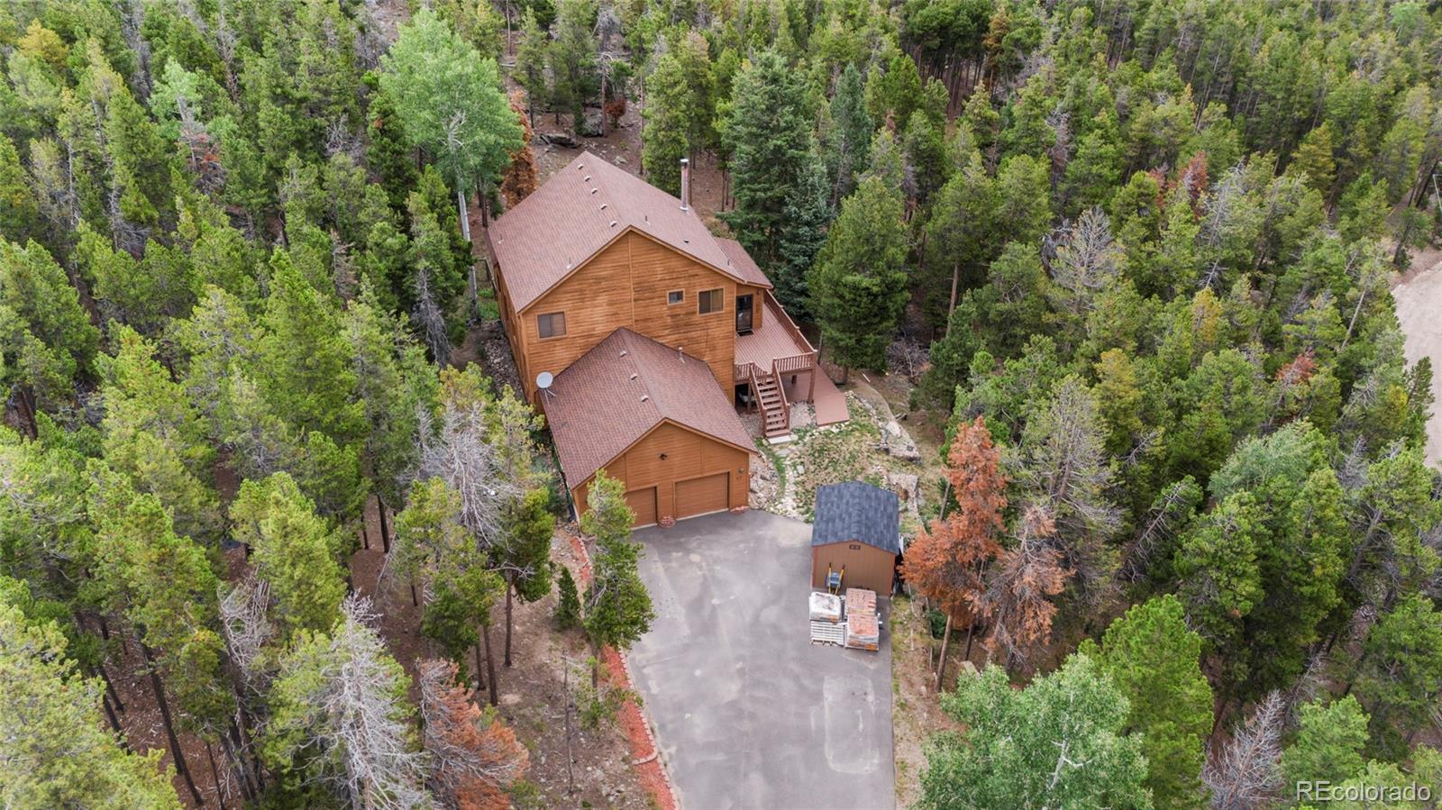 37 Juniper Court Evergreen, CO 80439 - Photo 4 of 44 an aerial view of a house