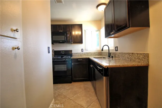 a kitchen with a sink and a stove