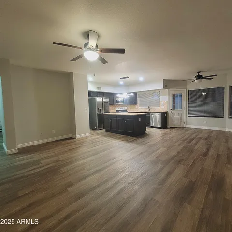 a view of a kitchen with a sink and a window