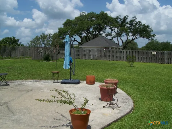 a view of a table and chairs in the garden
