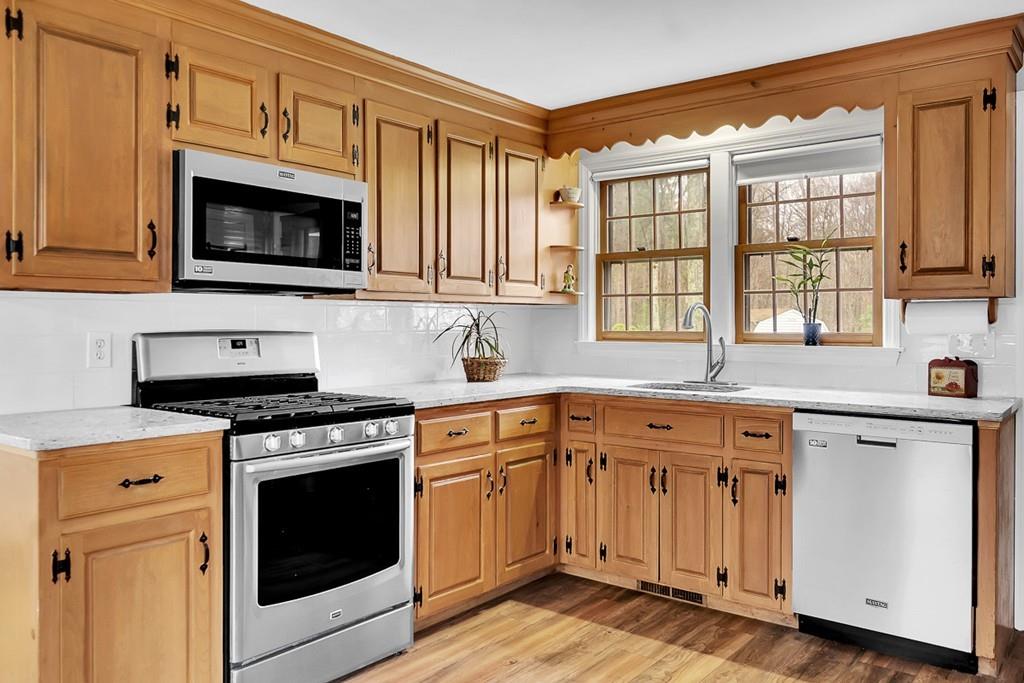 4 Canter Road Chelmsford, MA 01824 - Photo 2 of 35 a kitchen with cabinets stainless steel appliances and a sink