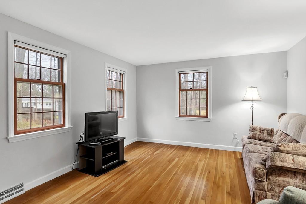 4 Canter Road Chelmsford, MA 01824 - Photo 9 of 35 a living room with furniture and a flat screen tv