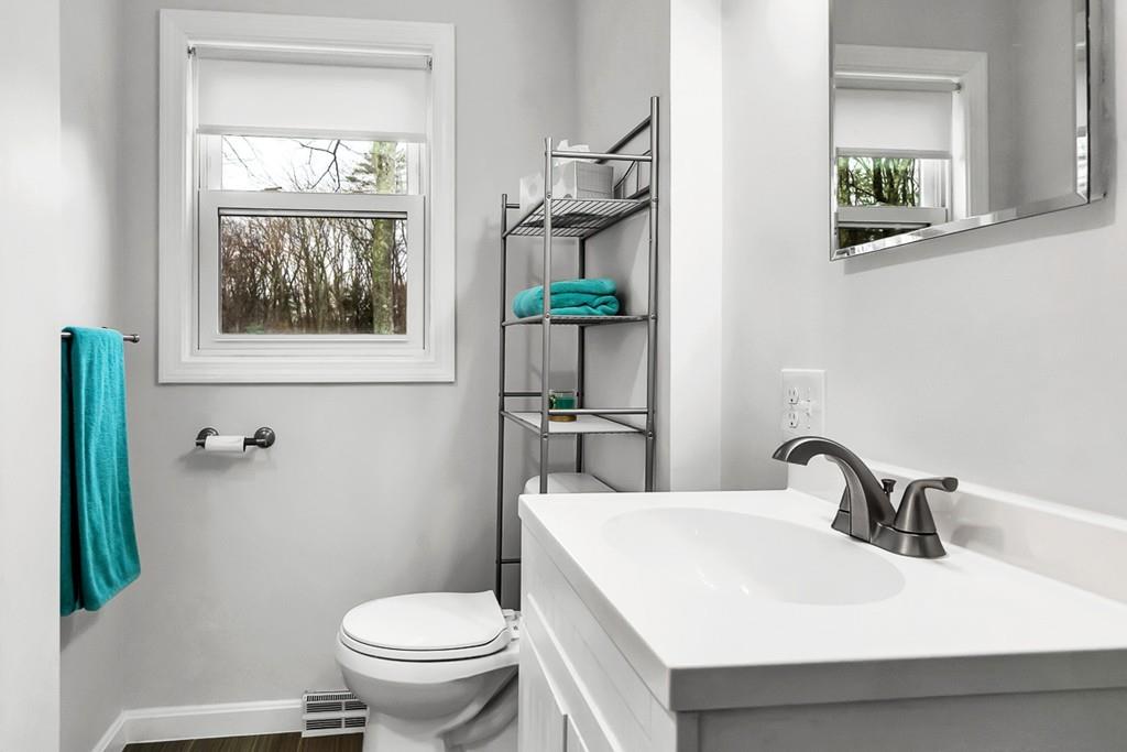 4 Canter Road Chelmsford, MA 01824 - Photo 10 of 35 a bathroom with a sink toilet and a mirror