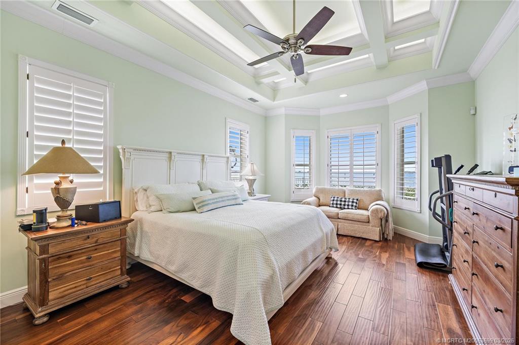 4105 Rigels Cove Way Jensen Beach, FL 34957 - Photo 25 of 80 a bedroom with a bed and wooden floor