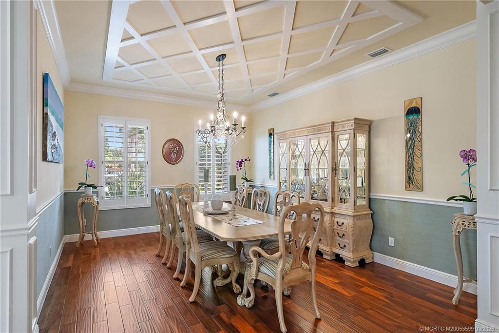 4105 Rigels Cove Way Jensen Beach, FL 34957 - Photo 64 of 80 a view of a dining room with furniture window and wooden floor