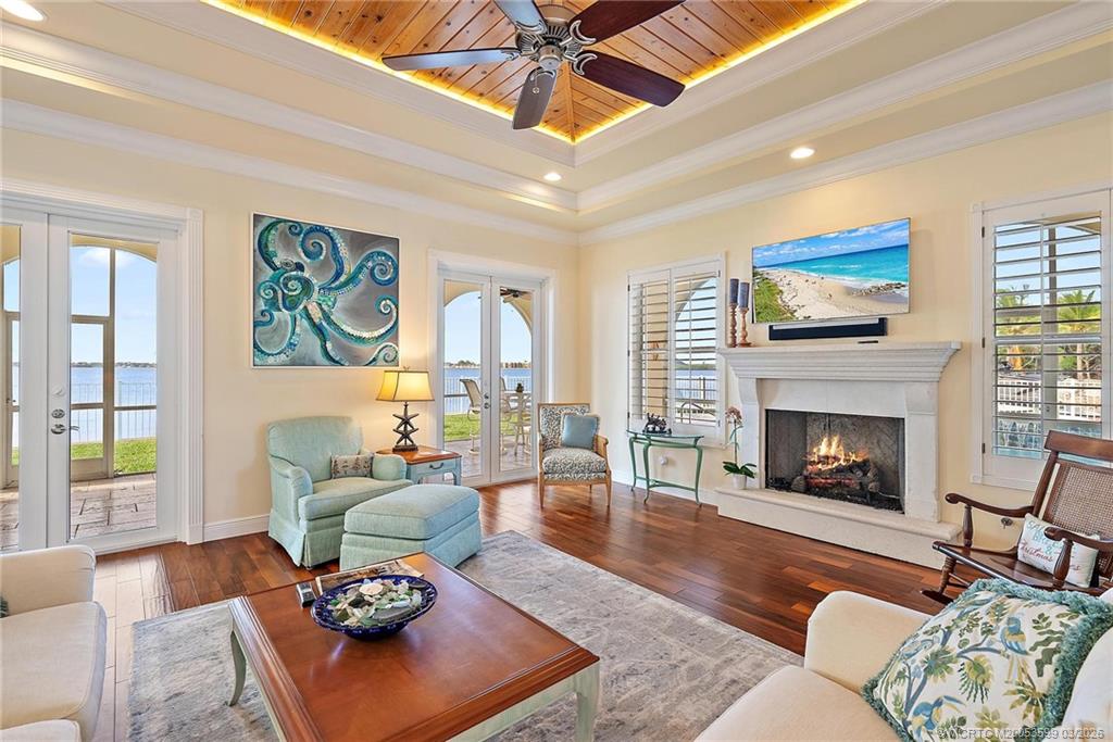4105 Rigels Cove Way Jensen Beach, FL 34957 - Photo 70 of 80 a living room with furniture fireplace and window