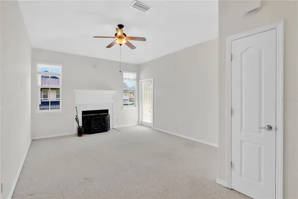 a view of empty room with windows