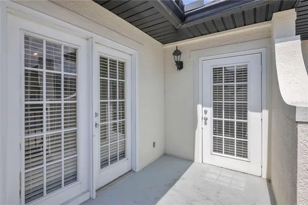 an aerial view of a house with a garden and swimming pool