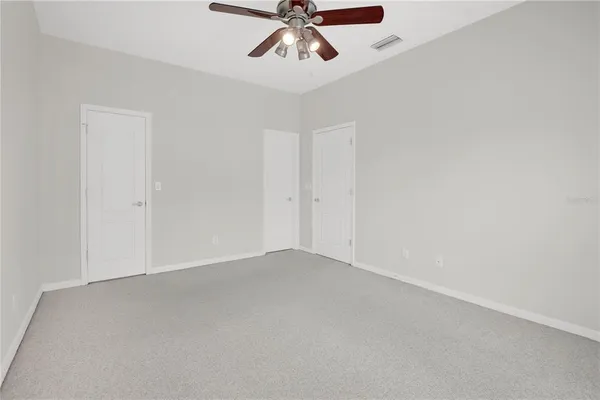 an aerial view of a swimming pool with outdoor seating yard and ocean view