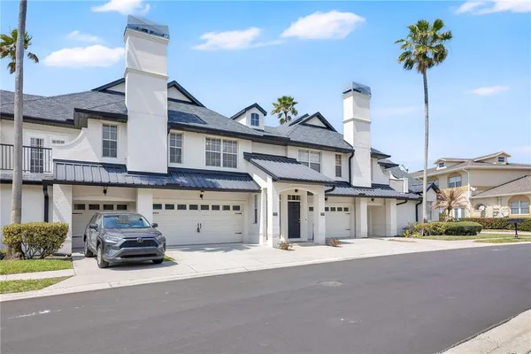 a kitchen with stainless steel appliances granite countertop a refrigerator stove a sink and a microwave