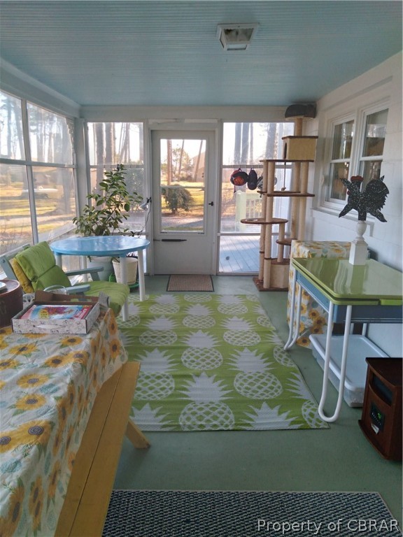 175 Seaside Way Gwynn, VA 23076 - Photo 16 of 48 a room with lots of wooden furniture and large windows