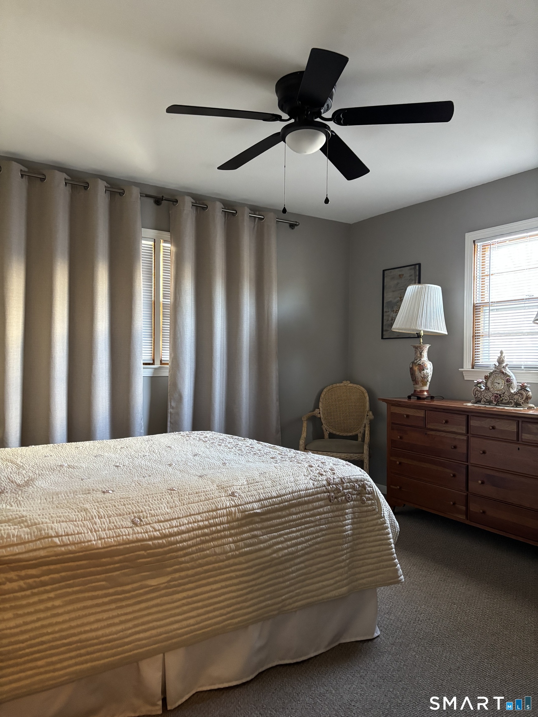 38 Timber Lane, Unit 1 Waterbury, CT 06705 - Photo 13 of 15 a bedroom with a large bed and a chandelier fan