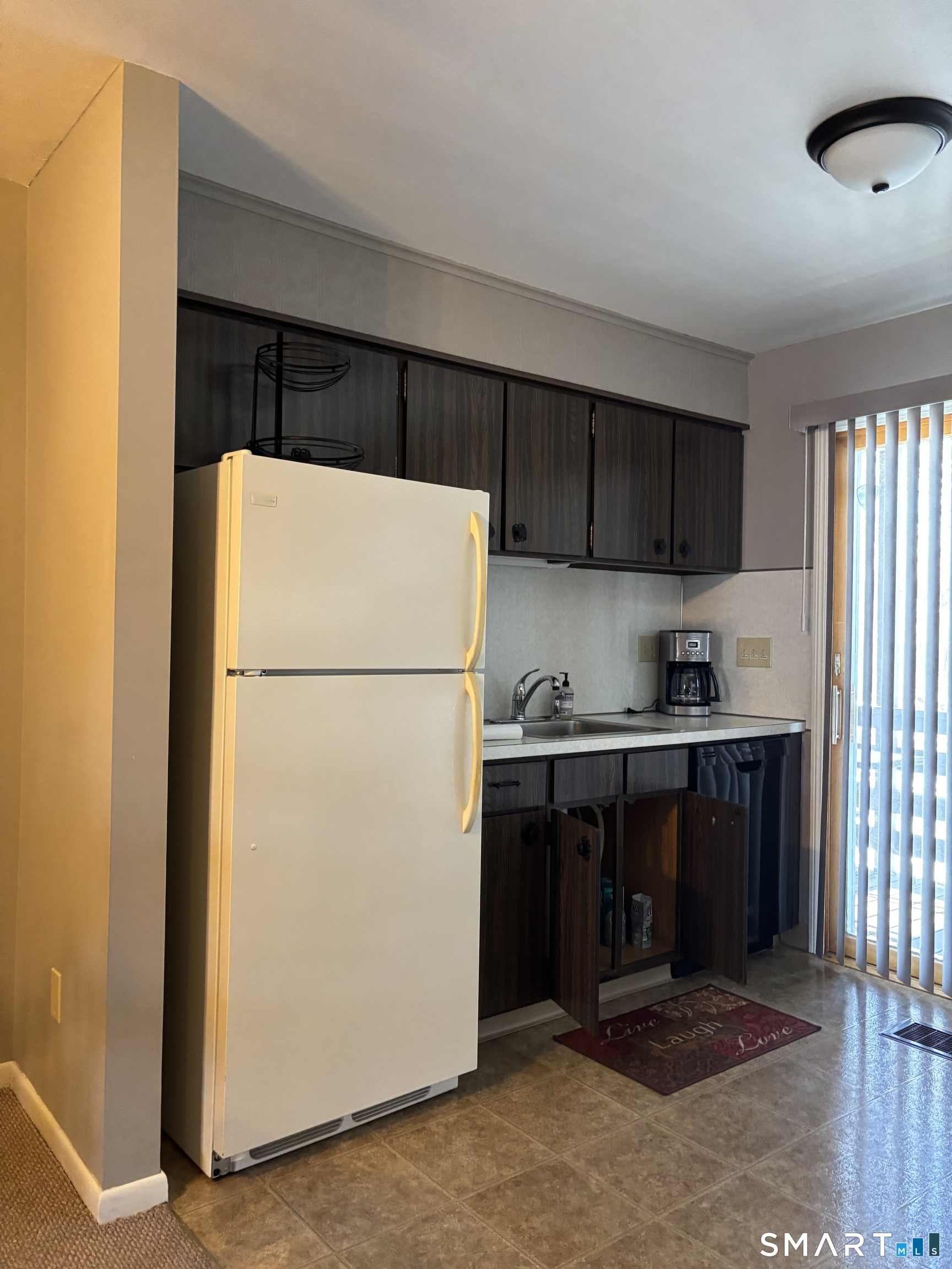38 Timber Lane, Unit 1 Waterbury, CT 06705 - Photo 5 of 15 a kitchen with a refrigerator and a stove top oven
