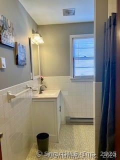 38 Timber Lane, Unit 1 Waterbury, CT 06705 - Photo 8 of 10 a bathroom with a sink a toilet and a mirror