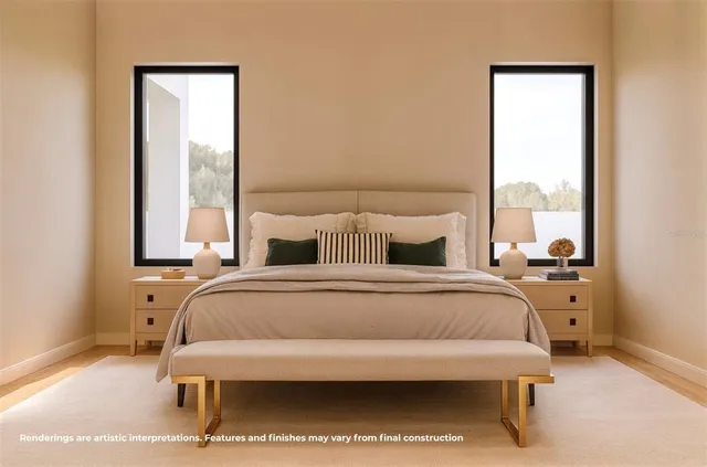 a bedroom with a bed and large window