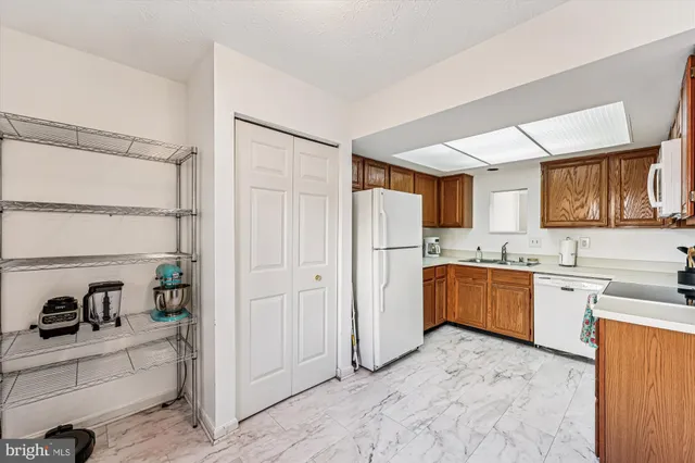a view of a hallway view with wooden floor and furniture