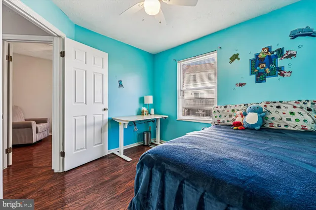 a bedroom with a bed and a table in it