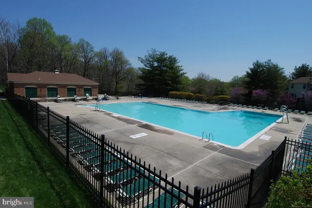 a view of outdoor space with playground and green space