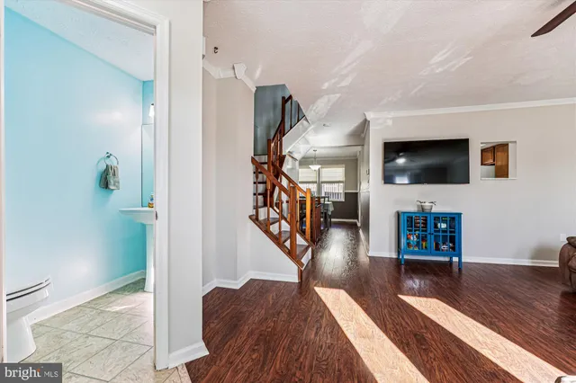 a bathroom with a sink toilet and mirror