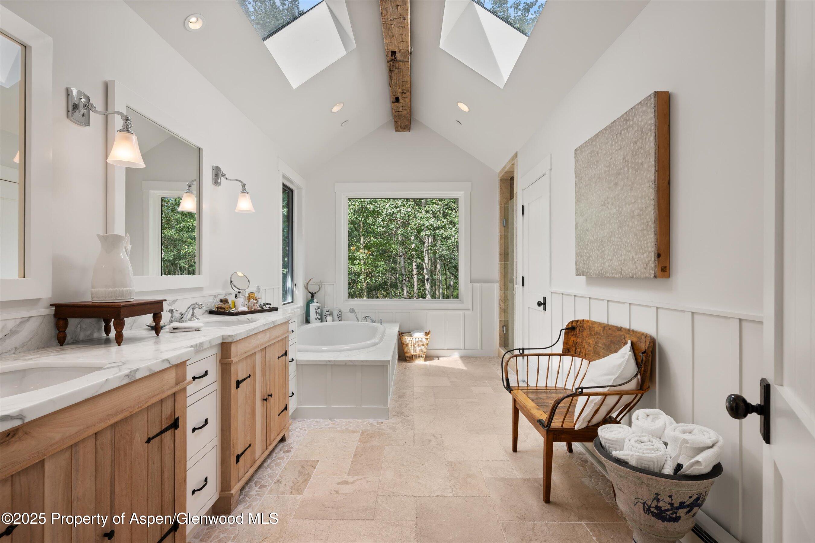 9555 Castle Creek Road Aspen, CO 81612 - Photo 17 of 42 a bathroom with a granite countertop sink and a mirror