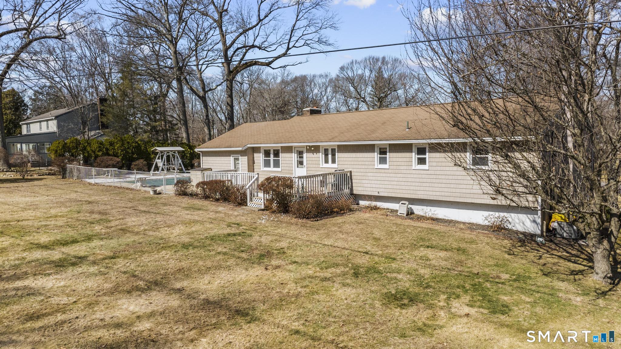 60 Quail Trail Trumbull, CT 06611 - Photo 12 of 37 a view of a house with a yard covered in snow