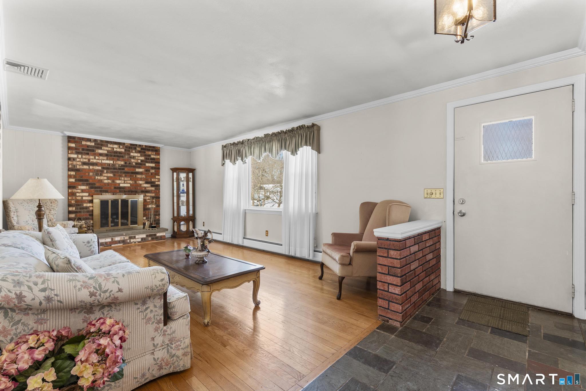 60 Quail Trail Trumbull, CT 06611 - Photo 16 of 37 a living room with furniture and a window