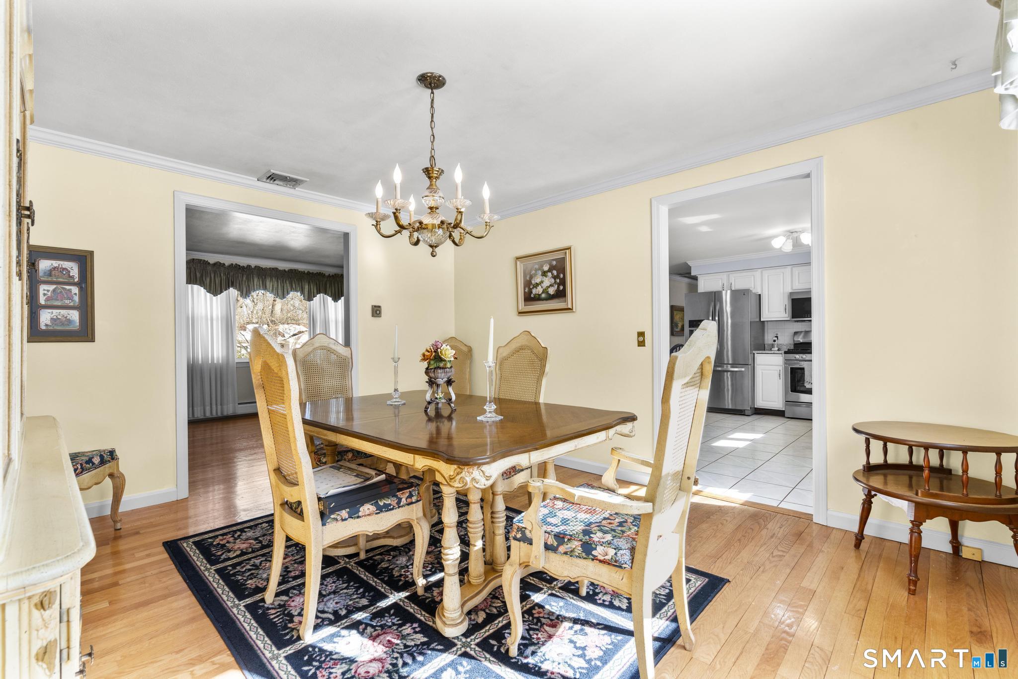 60 Quail Trail Trumbull, CT 06611 - Photo 18 of 37 a view of a dining room with furniture and wooden floor