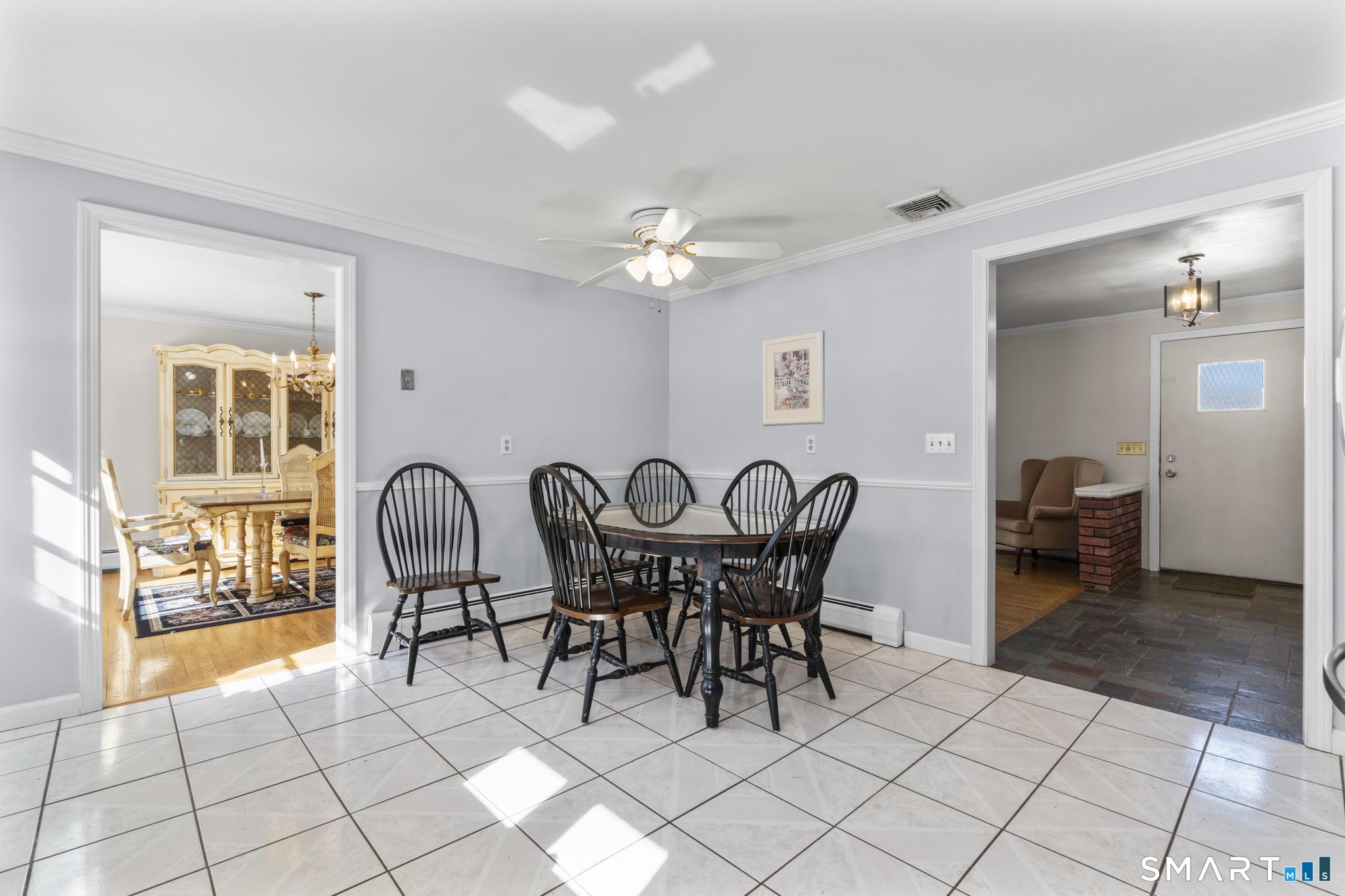 60 Quail Trail Trumbull, CT 06611 - Photo 21 of 37 a view of a dining room with furniture and chandelier