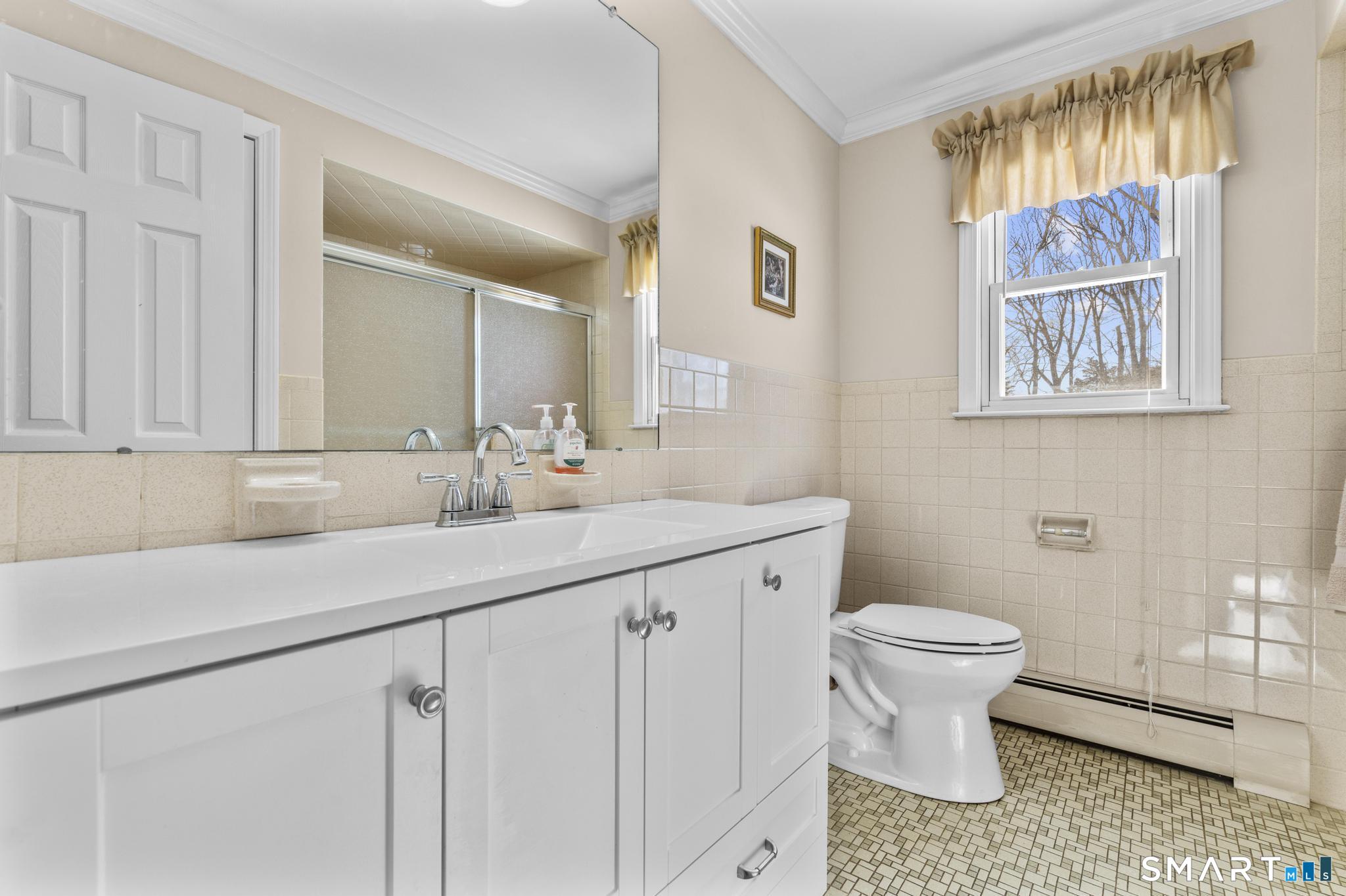 60 Quail Trail Trumbull, CT 06611 - Photo 22 of 37 a bathroom with a sink toilet and a mirror