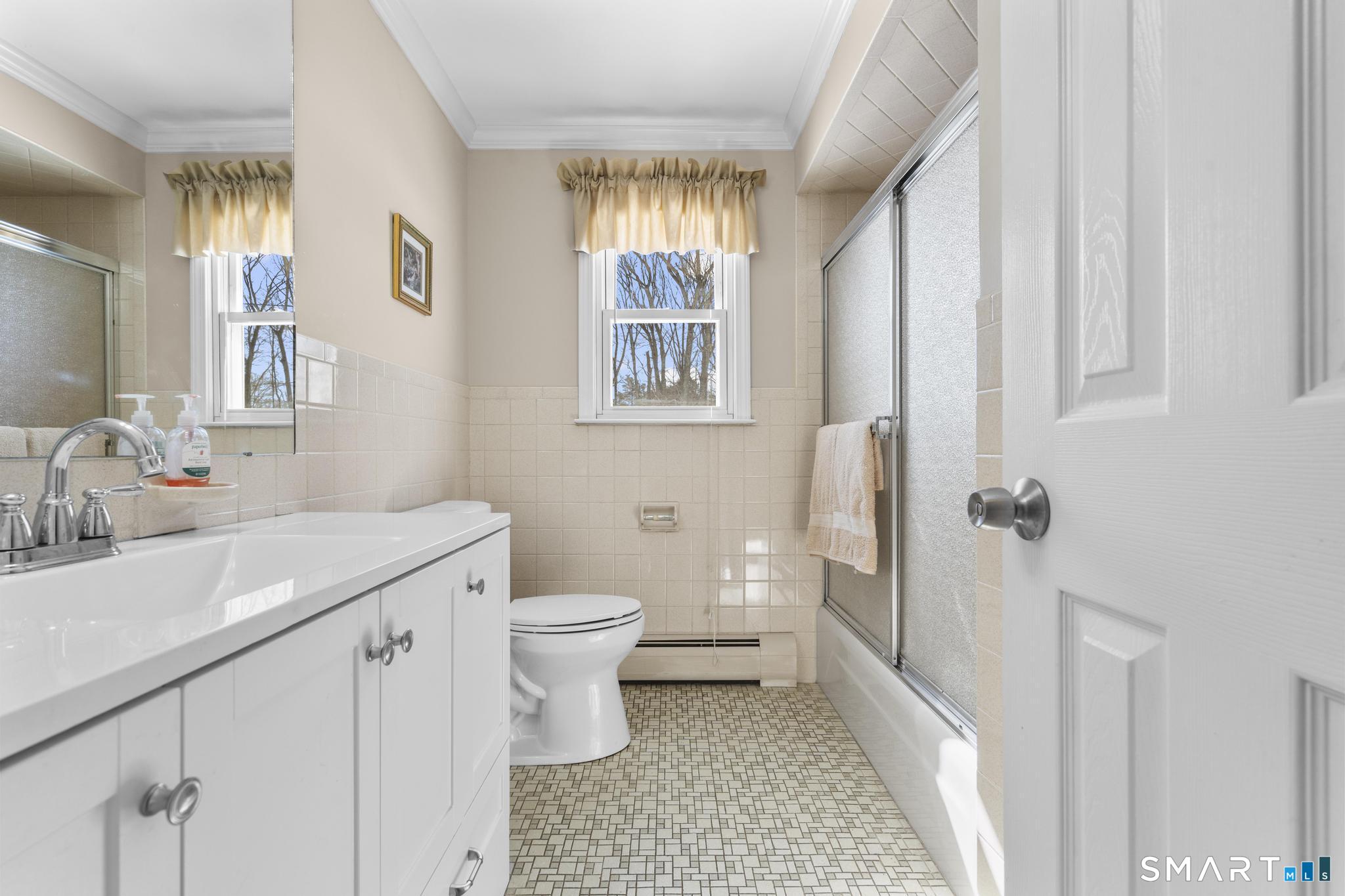 60 Quail Trail Trumbull, CT 06611 - Photo 23 of 37 a bathroom with a sink toilet and shower