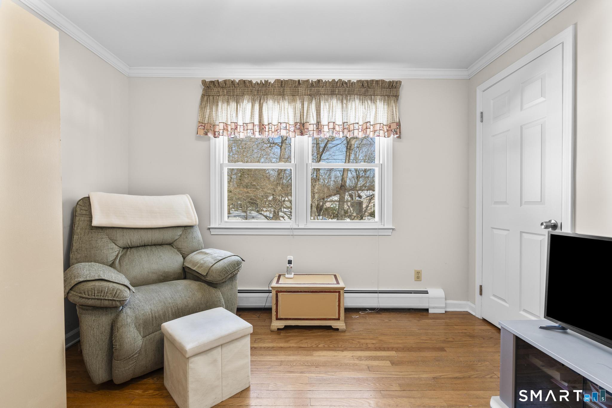 60 Quail Trail Trumbull, CT 06611 - Photo 25 of 37 a living room with furniture and a flat screen tv