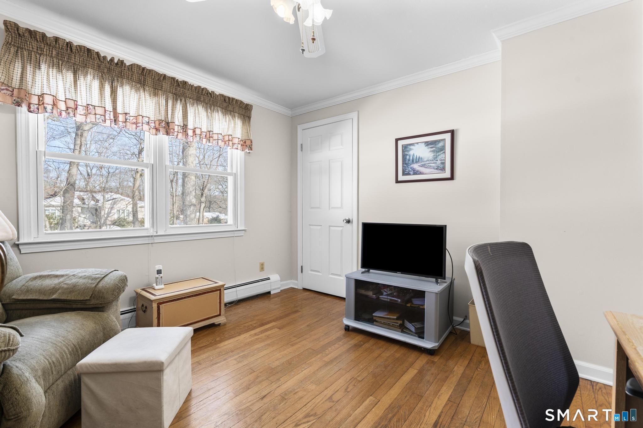 60 Quail Trail Trumbull, CT 06611 - Photo 26 of 37 a living room with furniture and a flat screen tv
