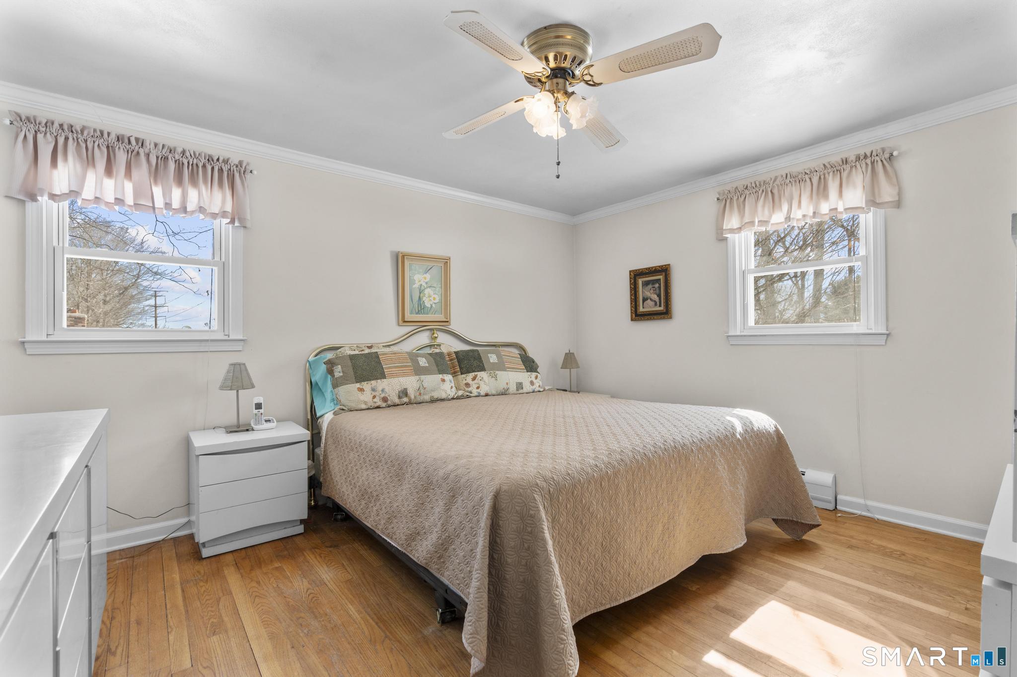 60 Quail Trail Trumbull, CT 06611 - Photo 29 of 37 a bedroom with a large bed and a window