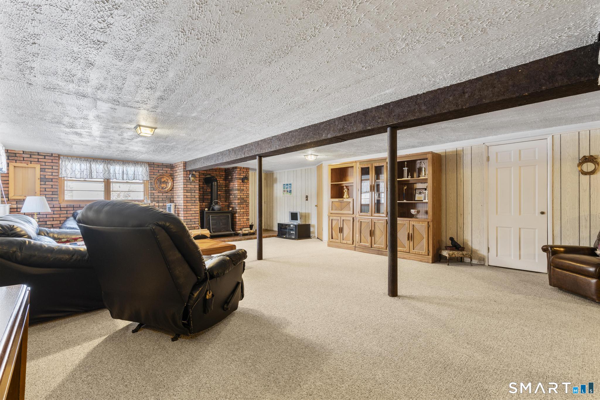 60 Quail Trail Trumbull, CT 06611 - Photo 34 of 37 a living room with furniture and large windows