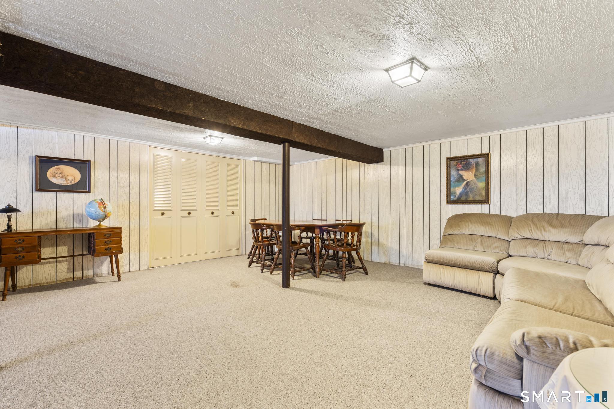 60 Quail Trail Trumbull, CT 06611 - Photo 36 of 37 a living room with furniture and a large window