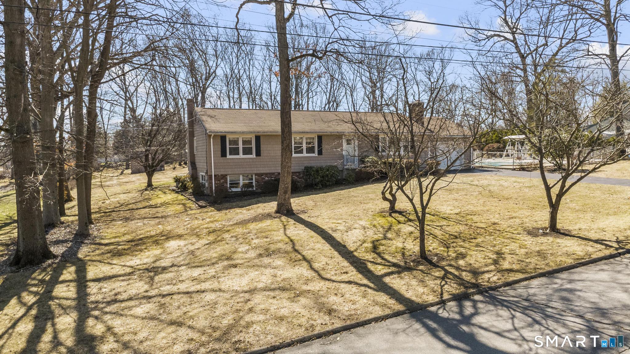 60 Quail Trail Trumbull, CT 06611 - Photo 6 of 37 a view of a house with snow on the road