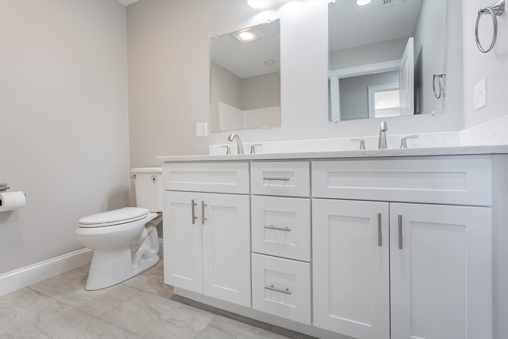 579 Summit Street, Unit 3 Fall River, MA 02724 - Photo 20 of 34 a bathroom with a toilet sink and mirror