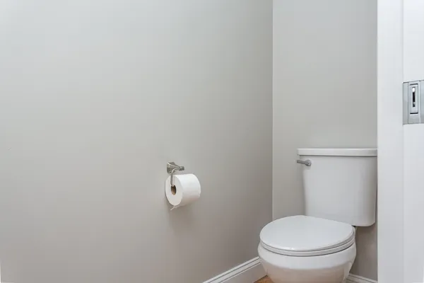 a bed room with a bed and a chair