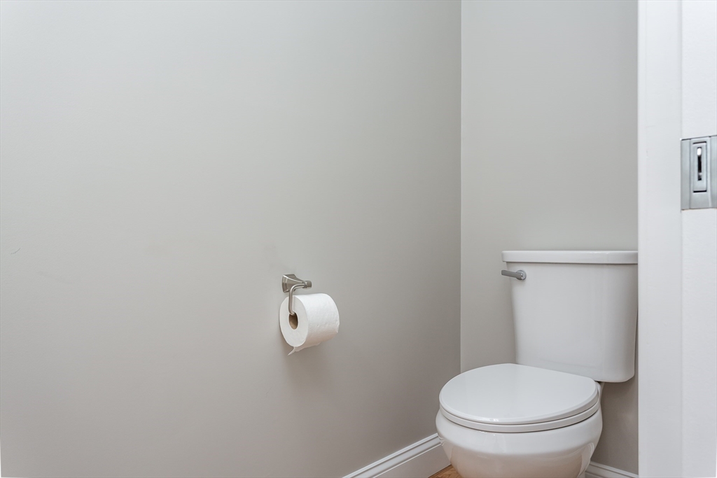 579 Summit Street, Unit 3 Fall River, MA 02724 - Photo 10 of 34 a white toilet sitting next to a bathroom sink