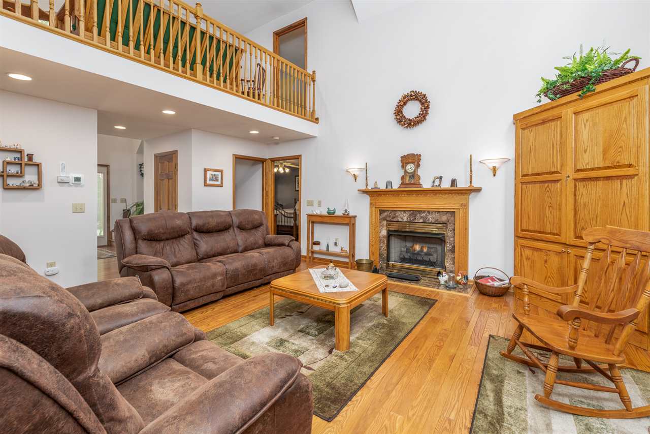 875 Bailey Road Fort Defiance, VA 24437 - Photo 20 of 49 a living room with furniture a fireplace and a flat screen tv