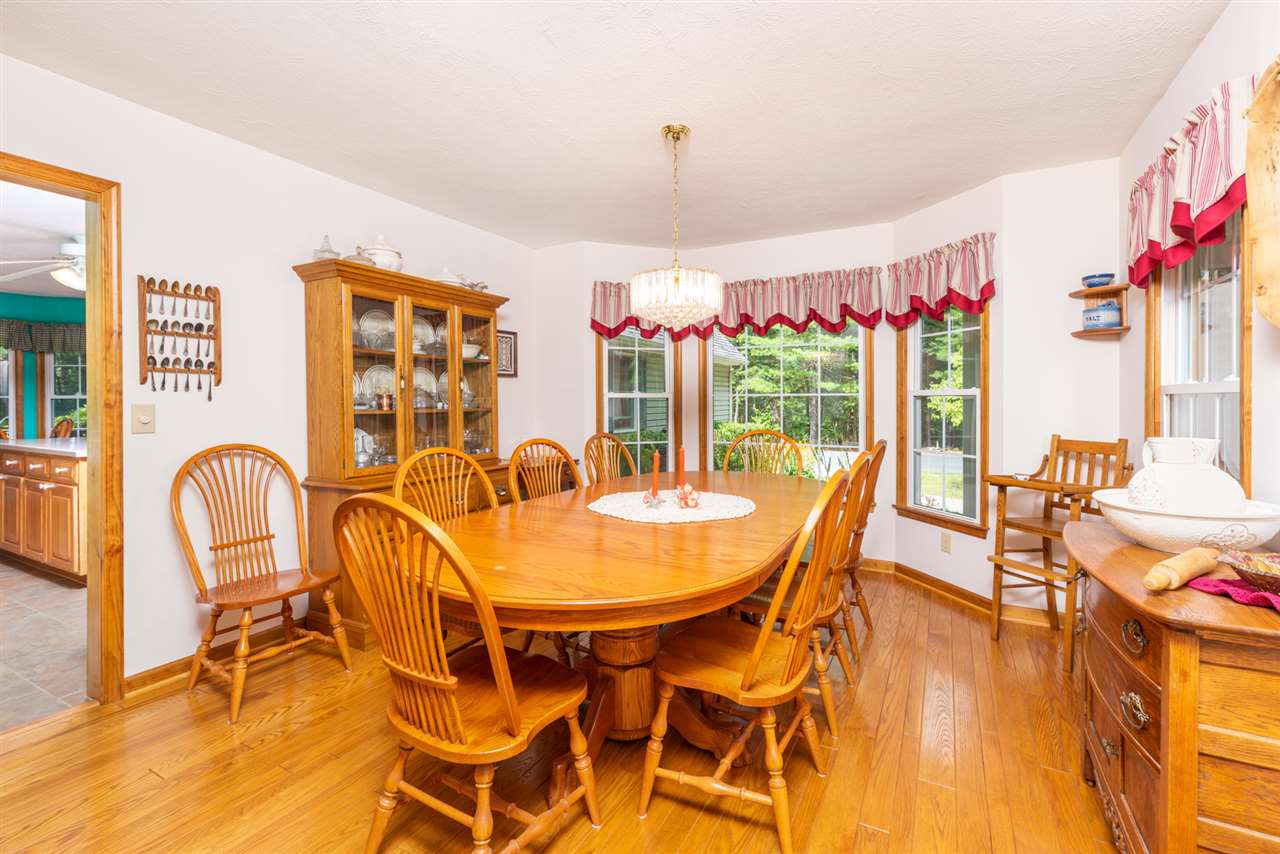 875 Bailey Road Fort Defiance, VA 24437 - Photo 26 of 49 a dining room with furniture a chandelier and wooden floor