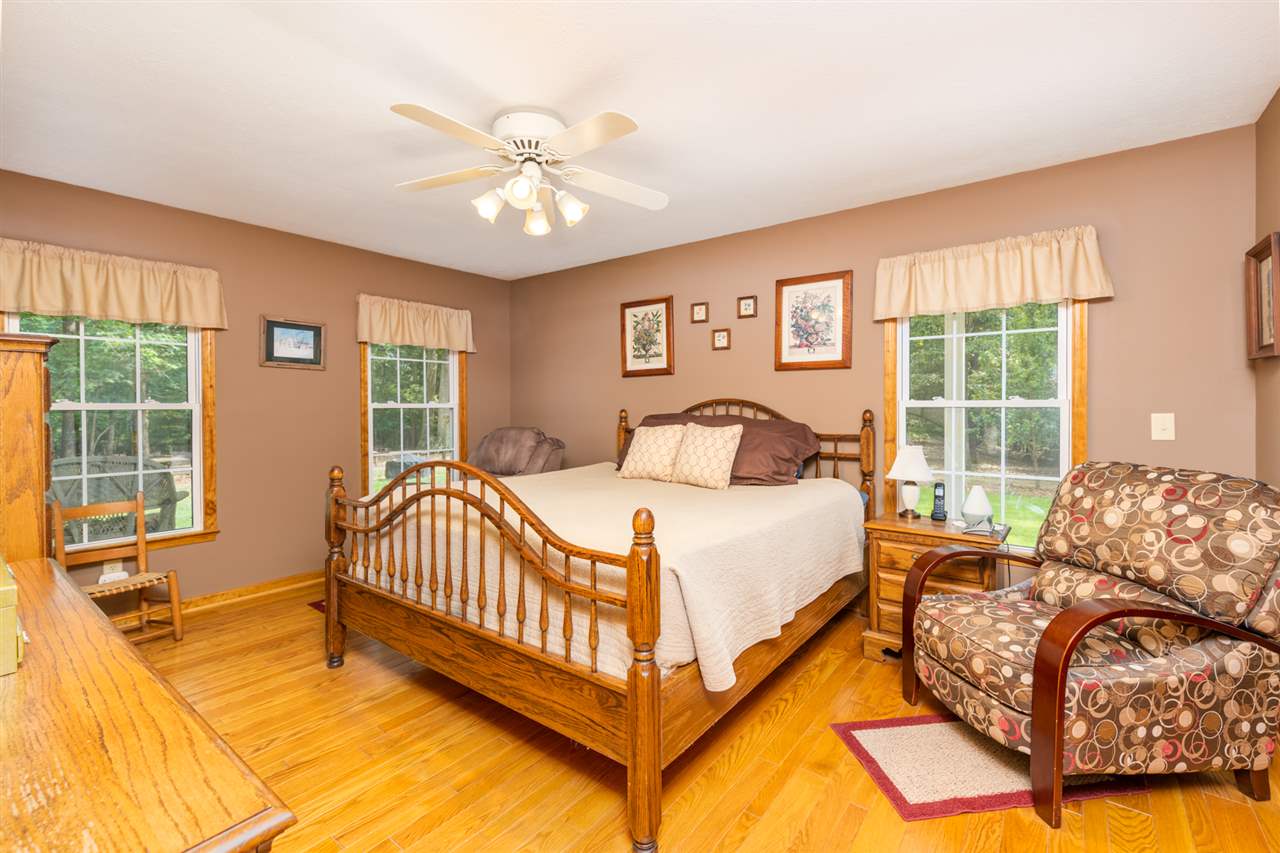 875 Bailey Road Fort Defiance, VA 24437 - Photo 29 of 49 a bed sitting in a bedroom next to a window