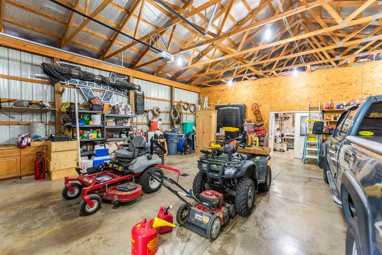 875 Bailey Road Fort Defiance, VA 24437 - Photo 47 of 49 a car and bike in a garage